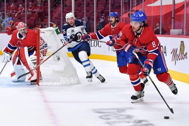 June 6: Ben Chiarot of the Montreal Canadiens looks to pass the puck observed by goalie Carey Price against the Winnipeg Jets in Game Three of the...