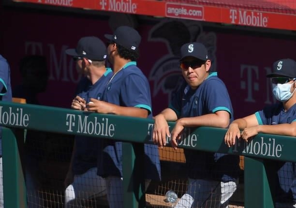 Yusei Kikuchi of the Seattle Mariners looks on from the dugout in the ninth inning against the Los Angeles Angels at Angel Stadium of Anaheim on June...