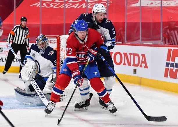 Tucker Poolman of the Winnipeg Jets defends against Tyler Toffoli of the Montreal Canadiens during the second period in Game Three of the Second...