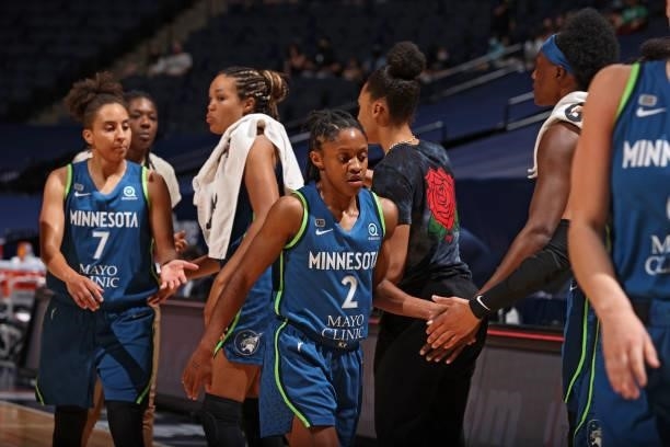 Crystal Dangerfield of the Minnesota Lynx high fives teammates during the game against the Atlanta Dream on June 6, 2021 at Target Center in...