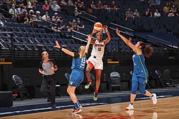 Courtney Williams of the Atlanta Dream shoots a half court shot against the Minnesota Lynx on June 6, 2021 at Target Center in Minneapolis,...