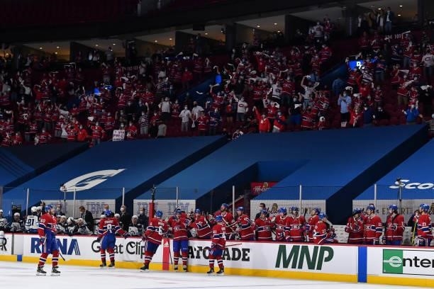 Fans cheer on the Montreal Canadiens after a short-handed goal by Joel Armia against the Winnipeg Jets during the second period in Game Three of the...