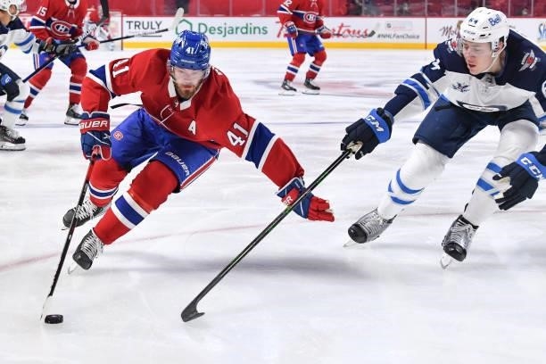 June 6: Paul Byron of the Montreal Canadiens skates with the puck under pressure from Logan Stanley of the Winnipeg Jets in Game Three of the Second...