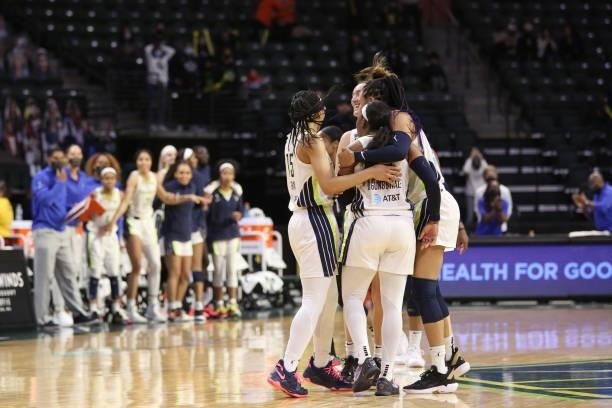 The Dallas Wings celebrate after Arike Ogunbowale scores a three point basket to win the game against the Seattle Storm on June 6, 2021 at the Angel...