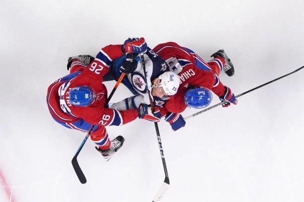 June 6: Jeff Petry and Ben Chiarot of the Montreal Canadiens defend the goal against Paul Stastny of the Winnipeg Jets in Game Three of the Second...