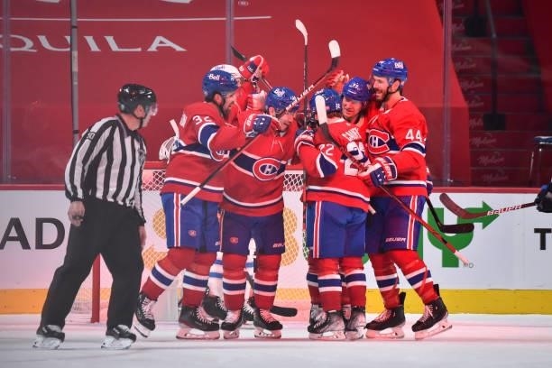 Nick Suzuki of the Montreal Canadiens celebrates his goal with teammates Erik Gustafsson, Cole Caufield, Tyler Toffoli and Joel Edmundson against the...