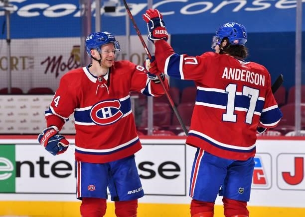 Corey Perry of the Montreal Canadiens and teammate Josh Anderson celebrate their victory against the Winnipeg Jets in Game Three of the Second Round...