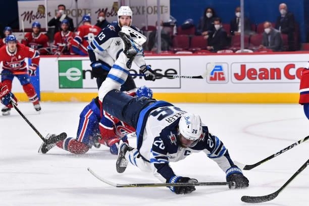 Blake Wheeler of the Winnipeg Jets falls to the ice against the Montreal Canadiens during the third period in Game Three of the Second Round of the...