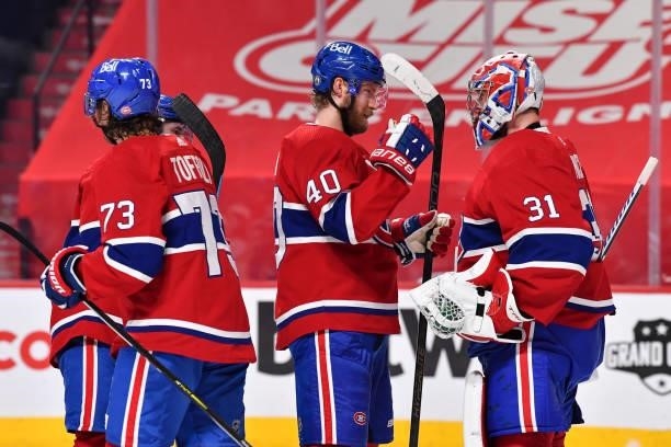 Joel Armia of the Montreal Canadiens and goaltender Carey Price celebrate their victory against the Winnipeg Jets in Game Three of the Second Round...
