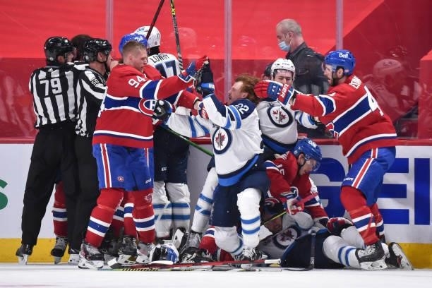 Scuffle breaks out between Corey Perry of the Montreal Canadiens and Mason Appleton of the Winnipeg Jets during the third period in Game Three of the...