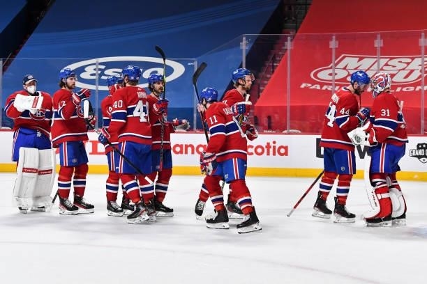 The Montreal Canadiens celebrate their victory against the Winnipeg Jets in Game Three of the Second Round of the 2021 Stanley Cup Playoffs at the...