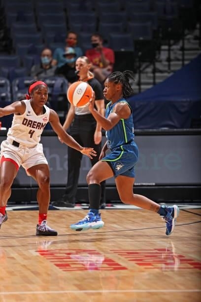 Crystal Dangerfield of the Minnesota Lynx passes the ball against the Atlanta Dream on June 6, 2021 at Target Center in Minneapolis, Minnesota. NOTE...