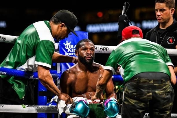 Former world welterweight king Floyd Mayweather sits in the corner in between rounds in an eight-round exhibition bout against YouTube personality...