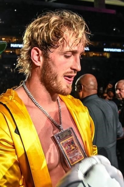 YouTube personality Logan Paul wears a pendant featuring a rare Charizard Pokemon card as he arrives to fight former world welterweight king Floyd...