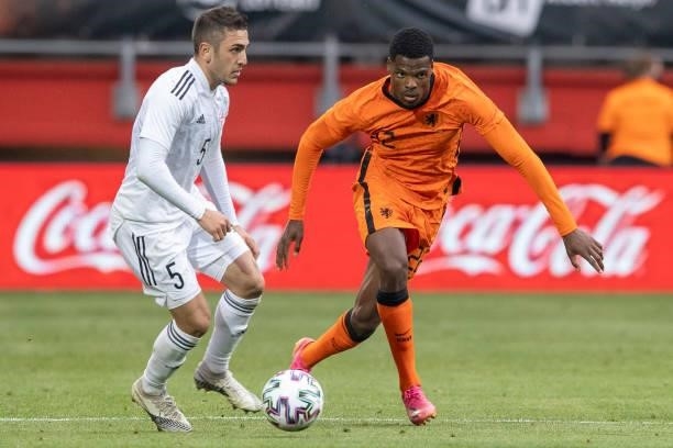 Guram Giorbelidze of Georgia and Denzel Dumfries of Netherlands Battle for the ball during the international friendly match between Netherlands and...