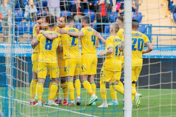Bogdan Lednev of Ukraine celebrates after scoring his team's first goal with teammates during the international friendly match between Ukraine and...