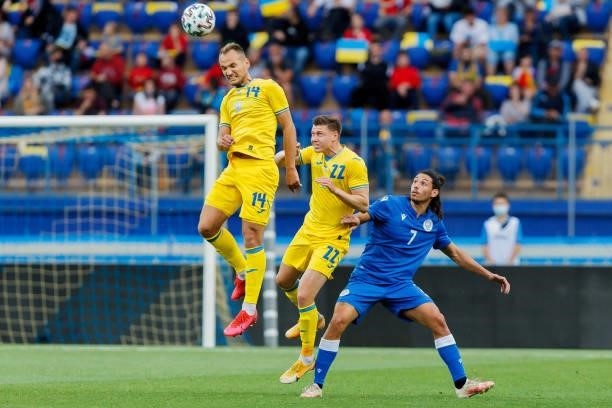 Artem Dovbyk of Ukraine, Mykola Matviyenko of Ukraine and Marios Ilia of Cyprus battle for the ball during the international friendly match between...