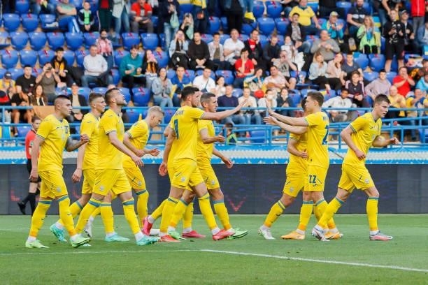 Bogdan Lednev of Ukraine celebrates after scoring his team's first goal with teammates during the international friendly match between Ukraine and...