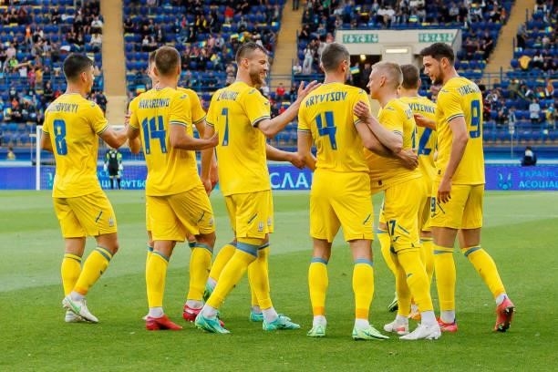 Oleksandr Zinchenko of Ukraine celebrates after scoring his team's second goal with teammates during the international friendly match between Ukraine...