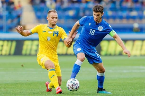Yevhen Makarenko of Ukraine and Kostakis Artymatas of Cyprus battle for the ball during the international friendly match between Ukraine and Cyprus...