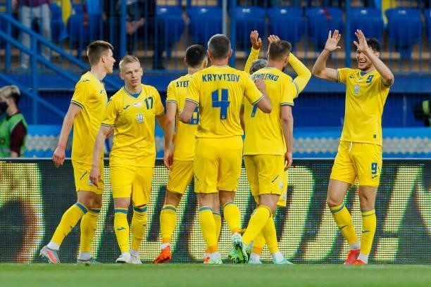 Roman Yaremchuk of Ukraine celebrates after scoring his team's third goal with teammates during the international friendly match between Ukraine and...