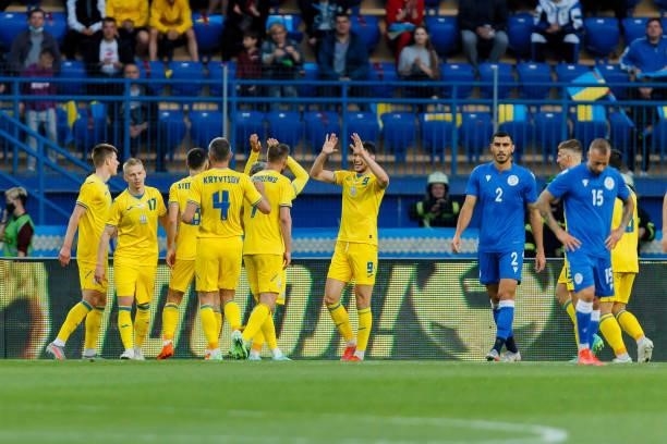 Roman Yaremchuk of Ukraine celebrates after scoring his team's third goal with teammates during the international friendly match between Ukraine and...