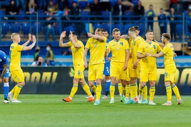 Andriy Yarmolenko of Ukraine celebrates after scoring his team's third goal with teammates during the international friendly match between Ukraine...