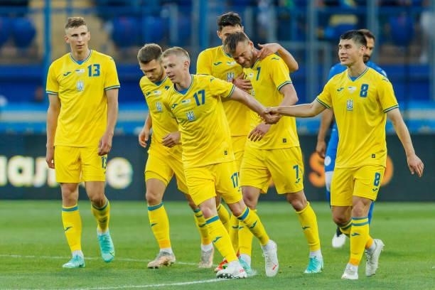 Andriy Yarmolenko of Ukraine celebrates after scoring his team's third goal with teammates during the international friendly match between Ukraine...