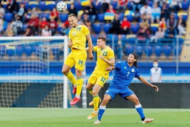 Yevhen Makarenko of Ukraine, Mykola Matviyenko of Ukraine and Marios Ilia of Cyprus battle for the ball during the international friendly match...