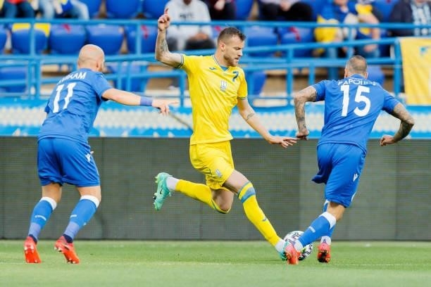 Andreas Avraam of Cyprus, Andriy Yarmolenko of Ukraine and Fotis Papoulis of Cyprus battle for the ball during the international friendly match...