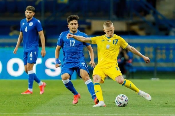Loizos Loizou of Cyprus and Oleksandr Zinchenko of Ukraine battle for the ball during the international friendly match between Ukraine and Cyprus at...