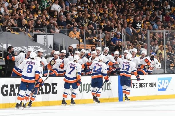 The New York Islanders celebrate the first period goal against the Boston Bruins in Game Five of the Second Round of the 2021 Stanley Cup Playoffs at...