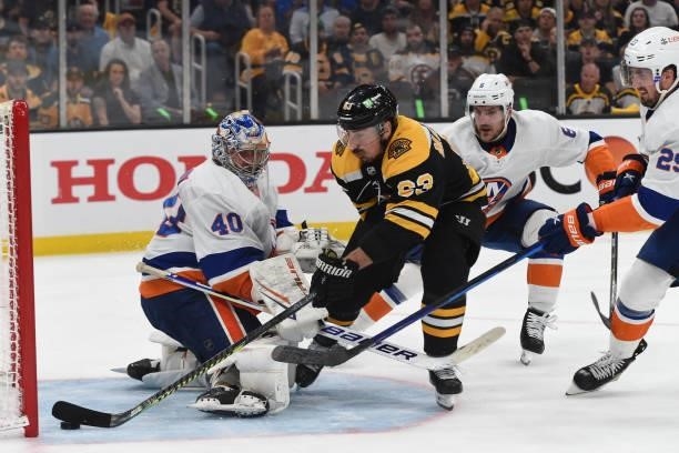 Brad Marchand of the Boston Bruins scores against the New York Islanders in Game Five of the Second Round of the 2021 Stanley Cup Playoffs at the TD...