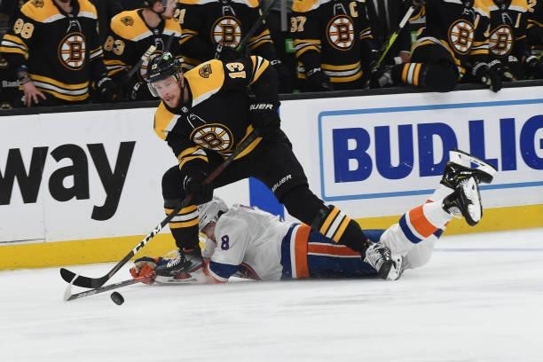 Charlie Coyle of the Boston Bruins skates against Noah Dobson of the New York Islanders in Game Five of the Second Round of the 2021 Stanley Cup...
