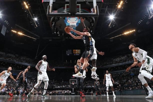 Joe Harris of the Brooklyn Nets drives to the basket against the Milwaukee Bucks during Round 2, Game 2 of the 2021 NBA Playoffs on June 7, 2021 at...