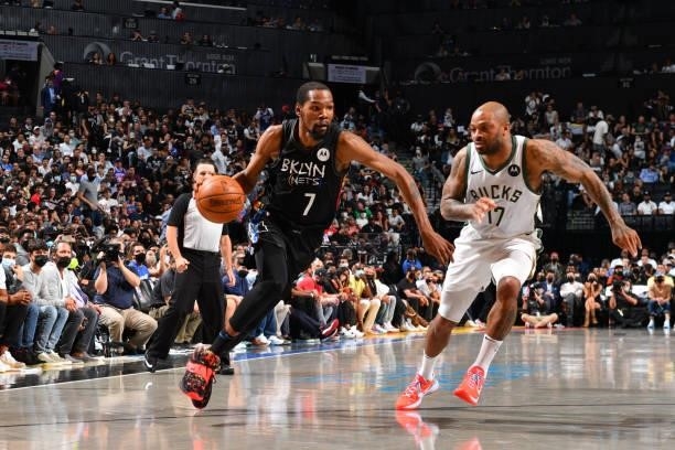Kevin Durant of the Brooklyn Nets handles the ball against P.J. Tucker of the Milwaukee Bucks during Round 2, Game 2 on June 7, 2021 at Barclays...