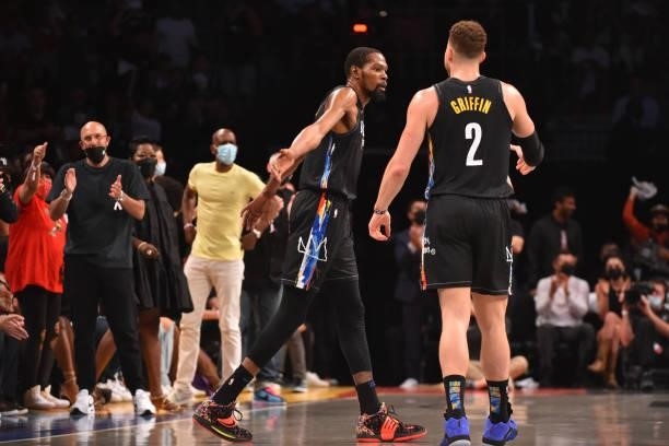 Kevin Durant of the Brooklyn Nets and Blake Griffin of the Brooklyn Nets high-five during Round 2, Game 2 on June 7, 2021 at Barclays Center in...