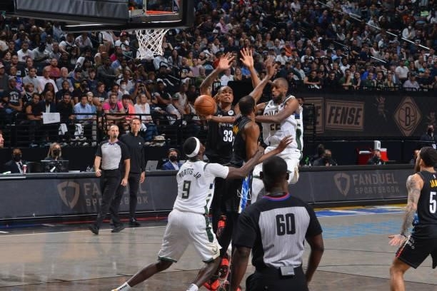 Khris Middleton of the Milwaukee Bucks passes the ball against the Brooklyn Nets during Round 2, Game 2 on June 7, 2021 at Barclays Center in...