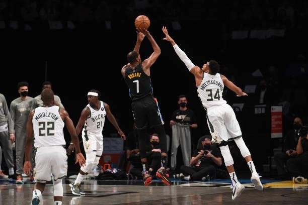 Kevin Durant of the Brooklyn Nets shoots the ball against Giannis Antetokounmpo of the Milwaukee Bucks during Round 2, Game 2 on June 7, 2021 at...
