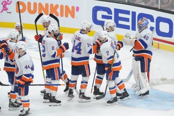 Te New York Islanders celebrate the win against the Boston Bruins in Game Five of the Second Round of the 2021 Stanley Cup Playoffs at the TD Garden...