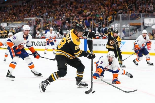 David Pastrnak of the Boston Bruins shoots the puck in the third period in Game Five of the Second Round of the 2021 Stanley Cup Playoffs against the...