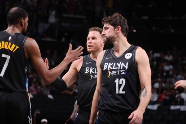 Blake Griffin of the Brooklyn Nets high fives Kevin Durant of the Brooklyn Nets during Round 2, Game 2 of the 2021 NBA Playoffs on June 7, 2021 at...