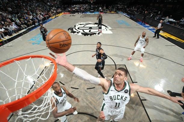 Brook Lopez of the Milwaukee Bucks rebounds the ball against the Brooklyn Nets during Round 2, Game 2 of the 2021 NBA Playoffs on June 7, 2021 at...