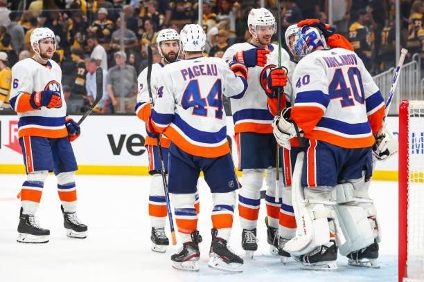 The New York Islanders react with Semyon Varlamov after a victory over the Boston Bruins in Game Five of the Second Round of the 2021 Stanley Cup...