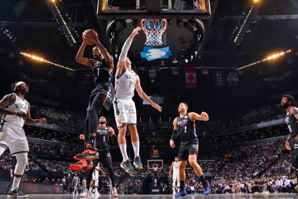 Kevin Durant of the Brooklyn Nets grabs the rebound against the Milwaukee Bucks during Round 2, Game 2 on June 7, 2021 at Barclays Center in...