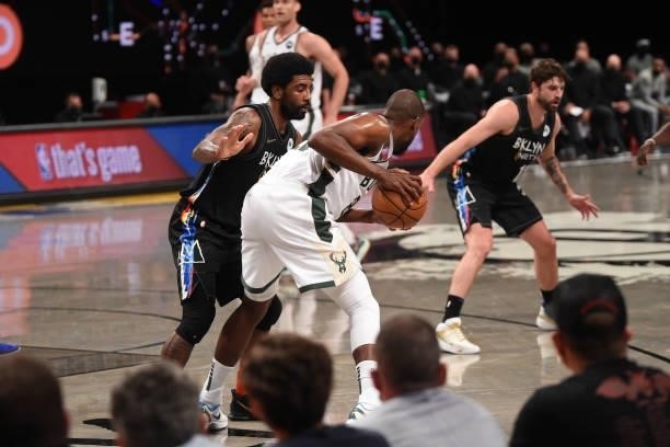 Kyrie Irving of the Brooklyn Nets plays defense against Khris Middleton of the Milwaukee Bucks during Round 2, Game 2 on June 7, 2021 at Barclays...