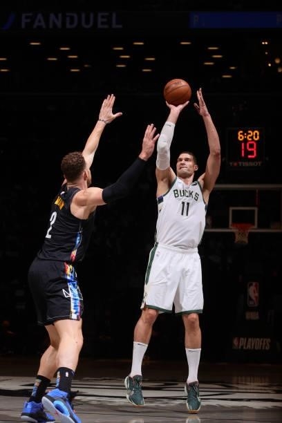 Brook Lopez of the Milwaukee Bucks shoots a three point basket against the Brooklyn Nets during Round 2, Game 2 of the 2021 NBA Playoffs on June 7,...
