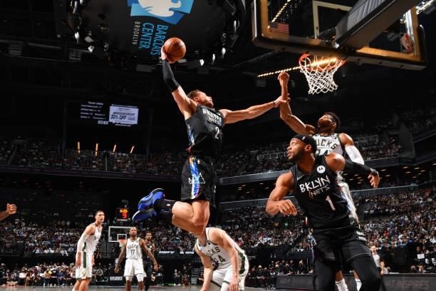 Blake Griffin of the Brooklyn Nets dunks the ball against Giannis Antetokounmpo of the Milwaukee Bucks during Round 2, Game 2 on June 7, 2021 at...