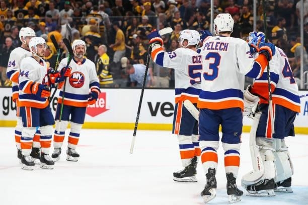 The New York Islanders celebrate with Semyon Varlamov after a victory over the Boston Bruins in Game Five of the Second Round of the 2021 Stanley Cup...