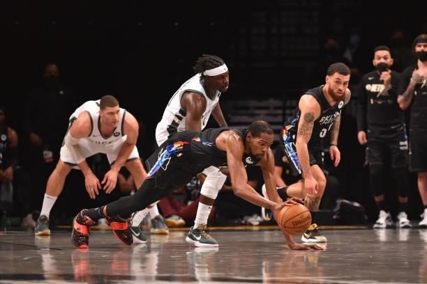 Kevin Durant of the Brooklyn Nets fights for the ball against the Milwaukee Bucks during Round 2, Game 2 on June 7, 2021 at Barclays Center in...